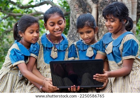 indian village government school girls operating laptop computer system at rural area in india Royalty-Free Stock Photo #2250586765