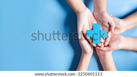 Health insurance concept. Doctor in a white coat uniform hand holding plus and healthcare medical icon, health and access to welfare health concept. Royalty-Free Stock Photo #2250601113