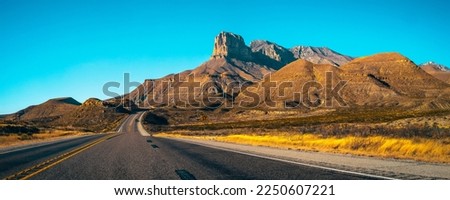 Guadalupe Mountains National Park landscape near El Captain Viewpoint on Route 62 in Salt Flat, Dell City, Texas, USA, panoramic retro-style autumn road scenery with golden grasses Royalty-Free Stock Photo #2250607221