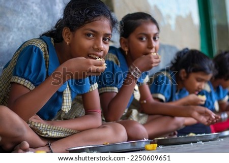 girls Student having mid day meal at school Royalty-Free Stock Photo #2250609651
