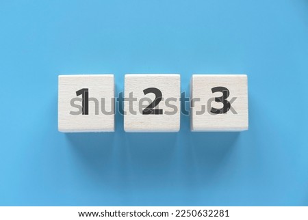 Wooden block with number of one, two and three. Royalty-Free Stock Photo #2250632281
