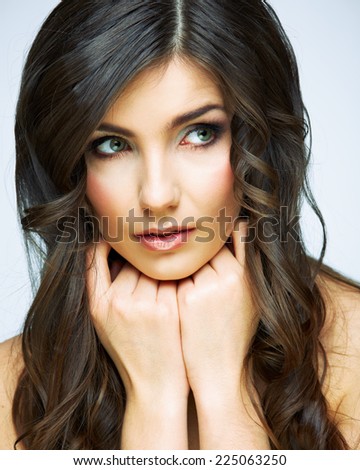 Beauty woman face close up portrait. Girl with long hair looking up side. Female model studio portrait.