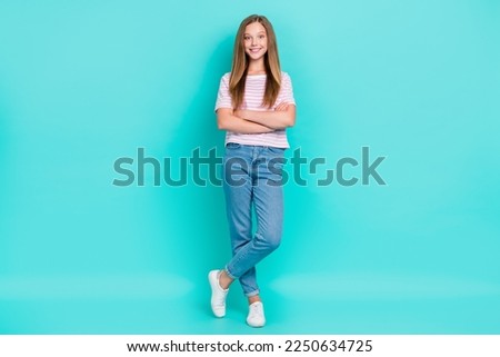 Full length photo of shiny confident lady wear striped t-shirt arms folded isolated turquoise color background Royalty-Free Stock Photo #2250634725
