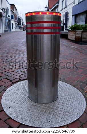 Coevorden, like many other cities in the Netherlands, has secured the main street against traffic with automatic traffic bollards with flashing lights Royalty-Free Stock Photo #2250646939