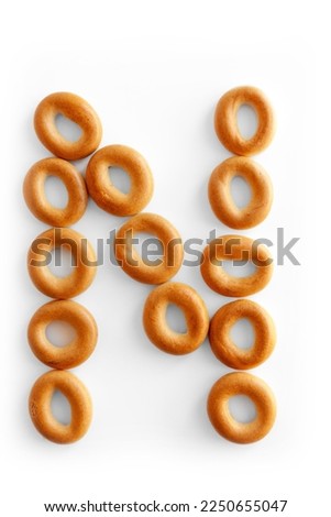 Letter N. Bagels font. Alphabet from set of small dry bagels isolated on white background. ABC symbols.
