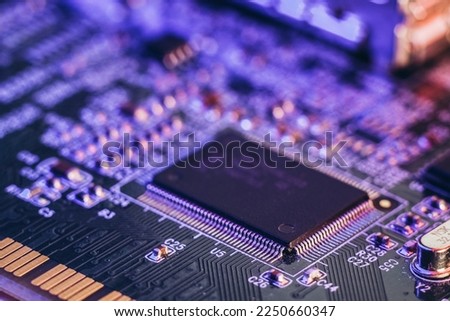 Shortage of chips in car manufacturing. High-tech production of electronic chips and electronic control boards. Royalty-Free Stock Photo #2250660347