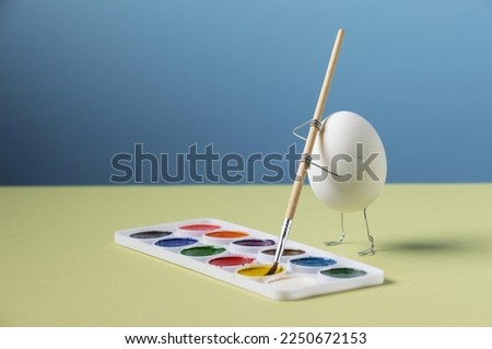 animated egg holding brush still life, egg taking brush and painting on on table, animated egg with colors collection and brush.