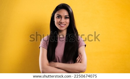 Confident young woman in close-up - studio photography