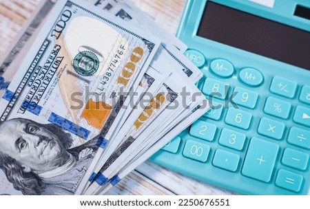 Money dollars and calculator, economy concept, money distribution. Euro. The crisis after the covid-19 pandemic. The dollar is falling or rising.