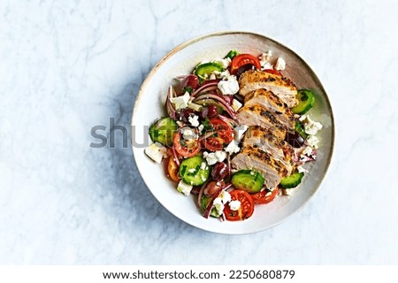 Greek salad with chicken. Top view. Copy space