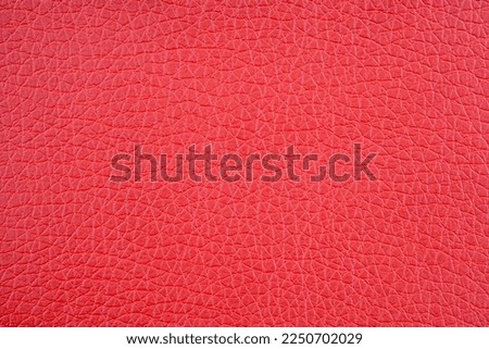 Red leatherette texture close up. Royalty-Free Stock Photo #2250702029