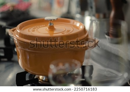 staub cocotte mustard cook ware Royalty-Free Stock Photo #2250716183