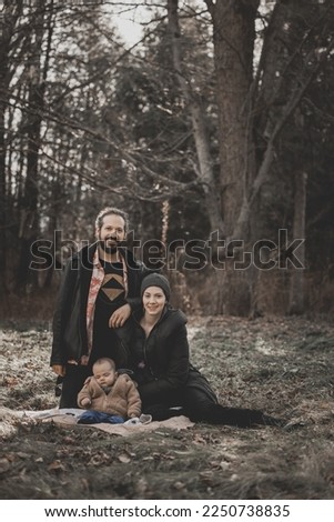 New born fall family photo shoot in forest on blanket