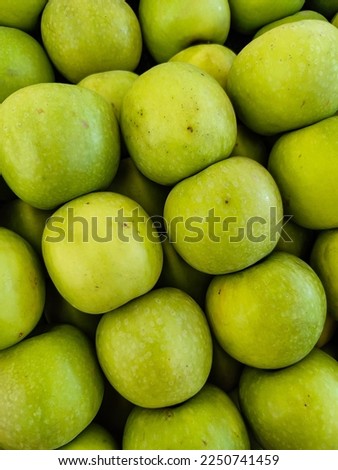 Collection of green apple fruit on supermarket. Groceries shop vegetable fresh.