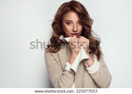 Beautiful young woman wearing warm cardigan