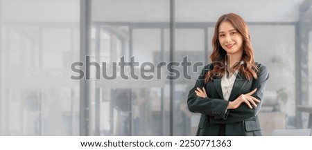 Confident asian business professional finance trader woman using trading app on laptop, sitting at monitor with trading infographics, charts, rates, chatting online, getting income, profit, smiling