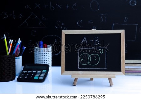 Blackboard with sample basic set hand written and geometric shapes