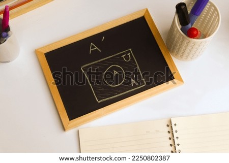 Blackboard with sample basic set hand written  and geometric shapes