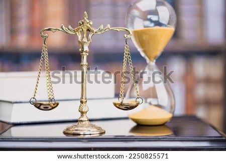 Legal office of lawyers, justice and law concept : Retro balance scale of justice on a desk in a courtroom, depicting giving fair and objective consideration to all evidence, without showing bias. Royalty-Free Stock Photo #2250825571