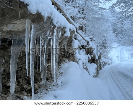 Winter glaciers and frozen water formations in the Swiss Alps and over the Lake Walen or Lake Walenstadt (Walensee) and in the Swiss Alps, Amden - Canton of St. Gallen, Switzerland (Schweiz)