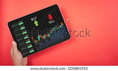 analyze stock chart data, stock market, trader or investor working at home. Technical price graph and indicator, red and green candlestick chart and stock trading computer screen background.