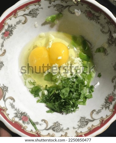 fill the egg with a little vegetable as a flavor enhancer, in Indonesia it is called pe