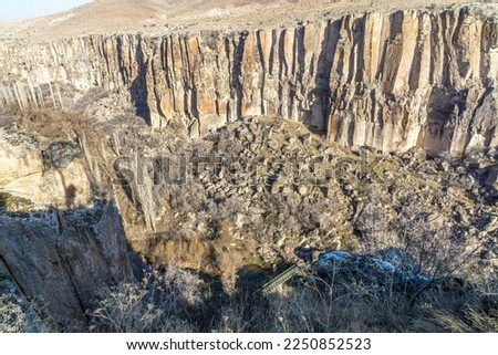 Ihlara valley is a canyon which is 15 km long and up to 150 m deep in Cappadocia, Güzelyurt,  contains around 50 rock-hewn churches and numerous rock-cut buildings. Royalty-Free Stock Photo #2250852523