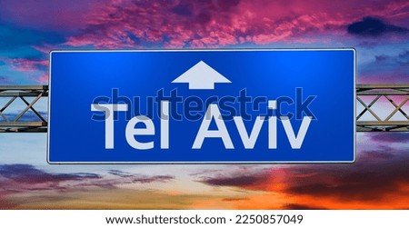 Road sign indicating direction to the city of Tel Aviv.
