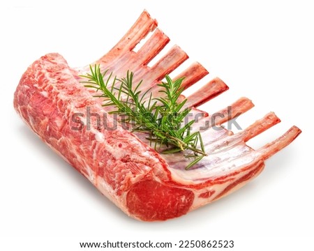 Fresh lamb rack with rosemary isolated on white background, Fresh Raw lamb loin on White Background With clipping path. Royalty-Free Stock Photo #2250862523