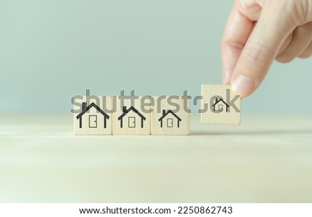 Downsizing home, houses concept. Downsizing property due to retirement or budget. Finding a tiny house or apartment. Moving to a smaller property for retirement time.  Increasing cash flow. Royalty-Free Stock Photo #2250862743