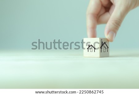 Downsizing home, houses concept. Downsizing property due to retirement or budget. Finding a tiny house or apartment. Moving to a smaller property for retirement time.  Increasing cash flow. Royalty-Free Stock Photo #2250862745