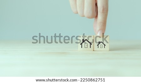 Downsizing home, houses concept. Downsizing property due to retirement or budget. Finding a tiny house or apartment. Moving to a smaller property for retirement time.  Increasing cash flow. Royalty-Free Stock Photo #2250862751