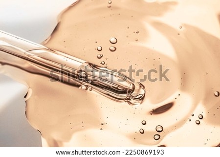 Cosmetic orange texture serum emulsion drop with pipette dropper Royalty-Free Stock Photo #2250869193