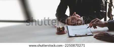 Attorneys or lawyers are advising clients in defamation cases, they are collecting evidence to bring charges against the parties for damages. The concept of defamation case counseling. Royalty-Free Stock Photo #2250870271
