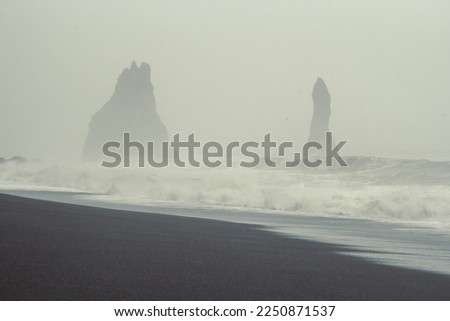 Teeth shaped cliffs in sea landscape photo. Beautiful nature scenery photography with fog on background. Idyllic scene. High quality picture for wallpaper, travel blog, magazine, article