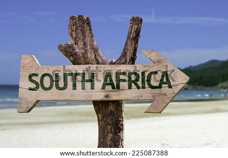South Africa wooden sign with a beach on background