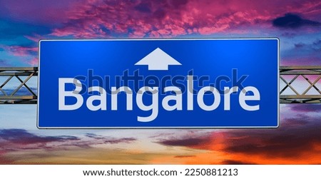 Road sign indicating direction to the city of Bangalore.