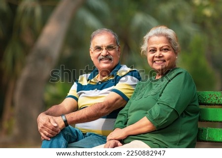 happy Old couple spending time together at park. Royalty-Free Stock Photo #2250882947