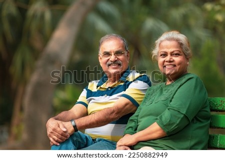 happy Old couple spending time together at park. Royalty-Free Stock Photo #2250882949