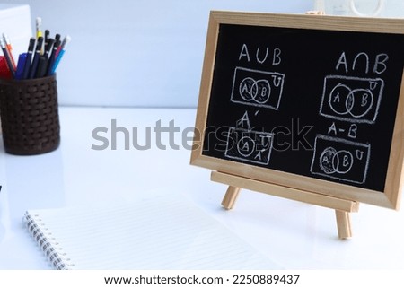 Blackboard with sample basic set hand written  and geometric shapes