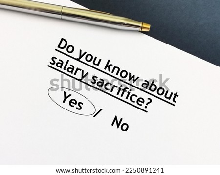 One person is answering question about retirement and pension. He knows about salary sacrifice. Royalty-Free Stock Photo #2250891241