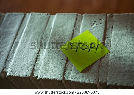 Stop warning on a yellow not stuck to a white wall 