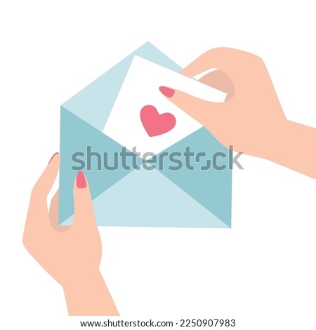 An envelope with a love message in women's hands, girl opens an envelope with a love message
