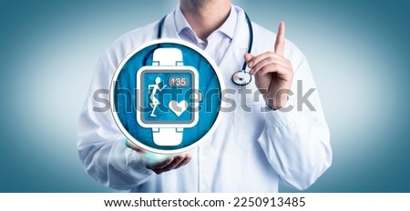 Unrecognizable cardiologist offering smart watch to track a patient’s heart beat during cardiovascular exercise. Healthcare and medical technology metaphor for Internet of Medical Things, IoMT.