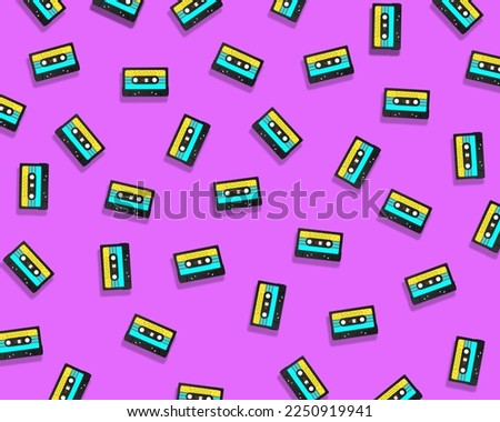 Set of colorful retro audio tape cassette, vintage mixtape on isolated pink background. Old technology.