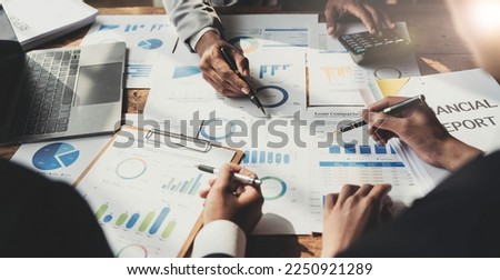 Business People Meeting using laptop computer,calculator,notebook,stock market chart paper for analysis Plans to improve quality next month. Conference Discussion Corporate Concept. Royalty-Free Stock Photo #2250921289