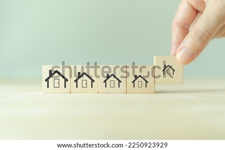 Downsizing home, houses concept. Downsizing property due to retirement or budget. Finding a tiny house or apartment. Moving to a smaller property for retirement time.  Increasing cash flow. Royalty-Free Stock Photo #2250923929