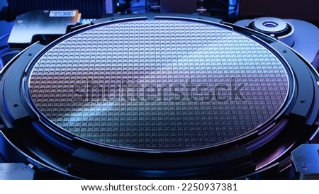 Front View of Silicon Wafer during Photolithography Process inside Complex Computer Chip Production Machine. Semiconductor Manufacturing at Fab or Foundry. Royalty-Free Stock Photo #2250937381