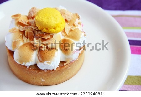 Lemon meringue cake on the plate - delicious french dessert