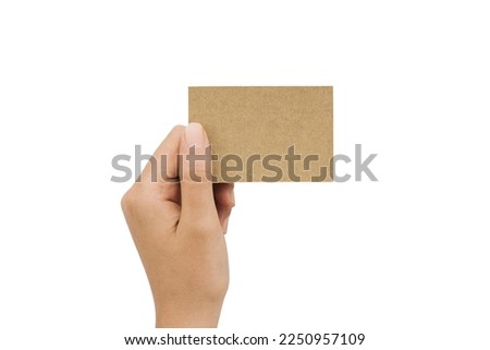 Hand holding a blank business card on white background